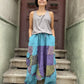 Kadınlar için Nepal patchwork şalvar. Taşlanmış kumaş, bol cep, salaş kesim ve ayarlanabilir bel ile S–XL arası bedenlere uyumlu. Bohem stil ile günlük konfor birleşiyor.