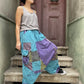Kadınlar için Nepal patchwork şalvar. Taşlanmış kumaş, bol cep, salaş kesim ve ayarlanabilir bel ile S–XL arası bedenlere uyumlu. Bohem stil ile günlük konfor birleşiyor.